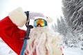 Santa Claus skiing in the mountains on snow in winter in Christm Royalty Free Stock Photo