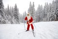 Santa Claus skiing in the mountains on snow in winter in Christm Royalty Free Stock Photo