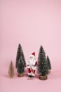 Santa Claus skiing on a pink background Royalty Free Stock Photo