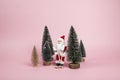 Santa Claus skiing on a pink background Royalty Free Stock Photo