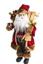 Santa Claus with skis, gifts and Christmas tree. santa toy isolated on white background Royalty Free Stock Photo