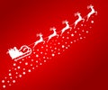 Santa Claus in sled rides in the reindeer on red Royalty Free Stock Photo