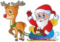 Santa Claus with sledge and deer