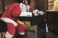 Santa claus sleep at the bar. Too drunk