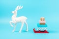 Santa claus sleigh with gift boxes and white reindeer on blue background. Minimal New Year concept Royalty Free Stock Photo