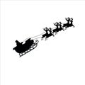 SANTA CLAUS ON A SLEIGH WITH REINDEER FLIES PAST THE MOON Royalty Free Stock Photo