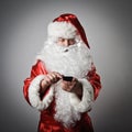 Santa Claus and smart phone Royalty Free Stock Photo