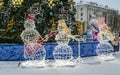 Santa Claus, Snow Maiden and snowmen, highlighted with colorful lights Royalty Free Stock Photo