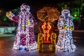 Santa Claus and Snow White statues brightly lit Royalty Free Stock Photo