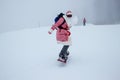 Santa Claus on a snowboard