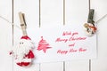 Santa Claus and snowman clothespin holding Christmas greeting ca Royalty Free Stock Photo