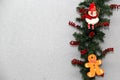 Santa claus, snowman and gingerbread cookie in christmas wreath with gray background, christmas decoration Royalty Free Stock Photo