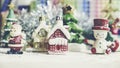 Santa Claus, snowman, houses and snow Sledge miniature model studio shot on colorful background for family, season, Christma Royalty Free Stock Photo