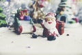 Santa Claus, snowman, houses & snow Sledge miniature model studio shot on colorful background for family, giving, season, Royalty Free Stock Photo