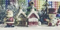 Santa Claus, snowman, houses & snow Sledge miniature model studio shot on colorful background for family, giving, season, Royalty Free Stock Photo