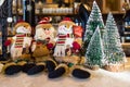 Santa Claus and snowman toys near frosted Christmas Tree. Christmas and New Year preparation