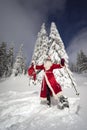 Santa Claus on snowshoes Royalty Free Stock Photo