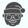 Santa Claus solid icon. Grandfather smilling face with conic hat. Christmas vector design concept, glyph style pictogram