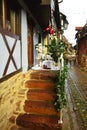 Santa Claus on the stairs in the historic town of Eguisheim, Alsace