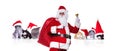 Santa claus standing in front of group of christmas cats Royalty Free Stock Photo