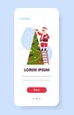 Santa claus standing on ladder decorating fir tree merry christmas happy new year holiday concept smartphone screen