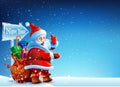 Santa Claus standing in the snow with a bag of gifts Royalty Free Stock Photo