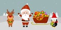 Santa Claus stands with his hands up, a number of sleds with gifts, a cute deer and a penguin in a Santa hat are holding gifts Royalty Free Stock Photo