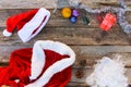 Santa Claus suit, small tree, pinecone, Christmas balls, garland, gift Royalty Free Stock Photo