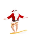 Santa Claus surfing with surf board Royalty Free Stock Photo