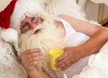 Santa Claus taking medicine Royalty Free Stock Photo