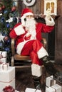 Santa claus talking to smart phone Royalty Free Stock Photo