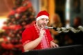 Santa Claus tapping microphone