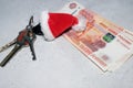 Santa Claus theme: Santa`s hand holding the keys to a new appartament Royalty Free Stock Photo