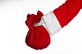 Santa Claus theme: Santa holding a big red sack with gifts on a white background Royalty Free Stock Photo