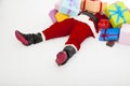 Santa claus too tired to lie on floor with many gift boxes Royalty Free Stock Photo