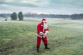 Santa Claus on the winter golf course plays golf. Christmas and new year Royalty Free Stock Photo