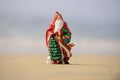 Santa Claus, tropical vacations concept. Christmas or New Year decoration on sea beach background with copy space. Royalty Free Stock Photo