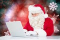 Santa claus using laptop Royalty Free Stock Photo