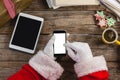 Santa claus using mobile phone Royalty Free Stock Photo