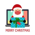 Santa Claus wearing medical face mask deliver gift via computer screen on white background. Santa giving presents online. Merry Ch Royalty Free Stock Photo