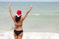 Santa claus woman on beach Royalty Free Stock Photo