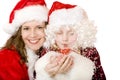 Santa Claus Woman and child blowing Christmas snow Royalty Free Stock Photo