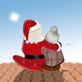 Santa Claus and woman sitting on the roof Royalty Free Stock Photo