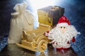 Santa Claus with wooden car, gift box and sack Royalty Free Stock Photo