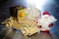 Santa Claus with wooden car, gift box and sack Royalty Free Stock Photo