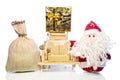 Santa Claus with wooden car, gift box and sack Royalty Free Stock Photo