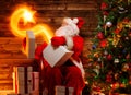 Santa Claus in wooden home interior Royalty Free Stock Photo