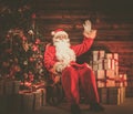 Santa Claus in wooden home interior Royalty Free Stock Photo