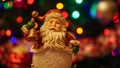 Close up of Santa Claus on a wooden Surface with christmas tree on background Royalty Free Stock Photo