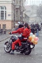 Santa Clauses on motorcycles delivering humanitarian aid for children